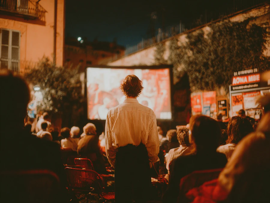 Rows of lawn chairs and blankets set up at dusk for an outdoor movie screening