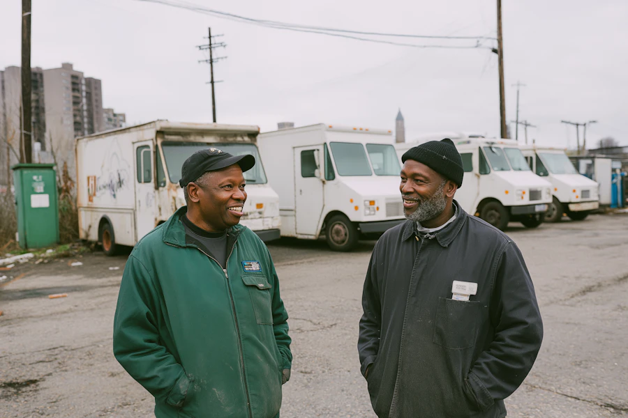 Men Chatting in Parking Lot