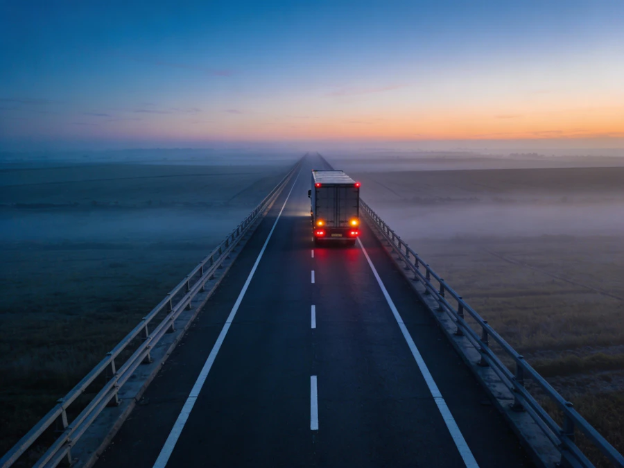 A highway stretching toward the horizon at dawn